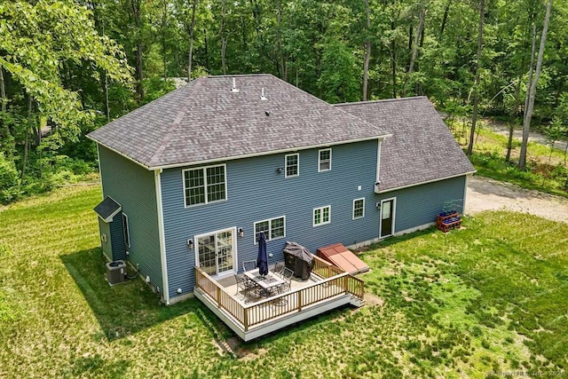 379 Tripp Hollow Rd, Brooklyn, CT 06234 - back of property featuring a deck, a lawn, roof with shingles, and a forest view