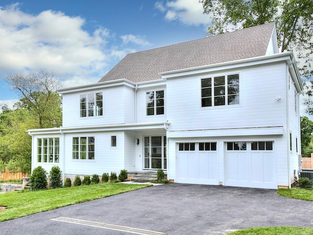 2 Webb Rd, Westport, CT 06880 - view of front of home featuring driveway, an attached garage, and a front yard