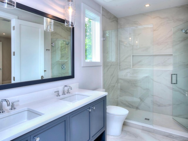 2 Webb Rd, Westport, CT 06880 - bathroom with marble look tile flooring, a marble finish shower, and double vanity