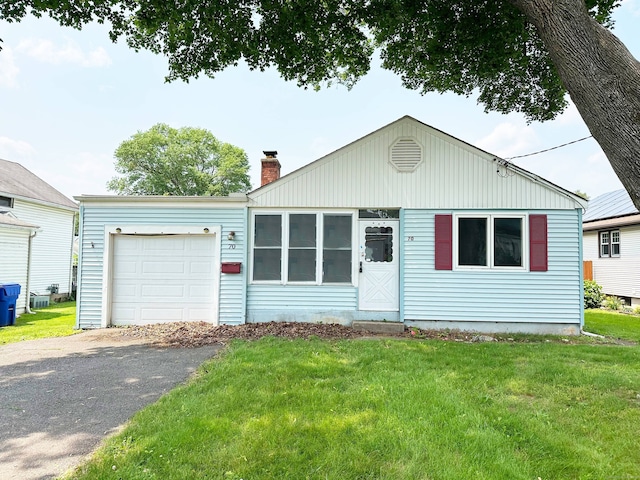 70 Cedar Ridge Rd, Newington, CT 06111 - view of front of home with an attached garage, a chimney, a front yard, and asphalt driveway