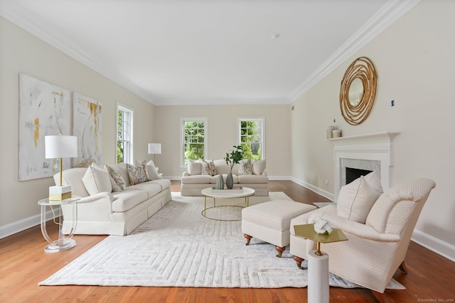 2787 Redding Rd, Fairfield, CT 06824 - living room featuring healthy amount of natural light, crown molding, wood finished floors, and a premium fireplace