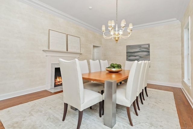2787 Redding Rd, Fairfield, CT 06824 - dining space with a chandelier, wood finished floors, crown molding, and a premium fireplace