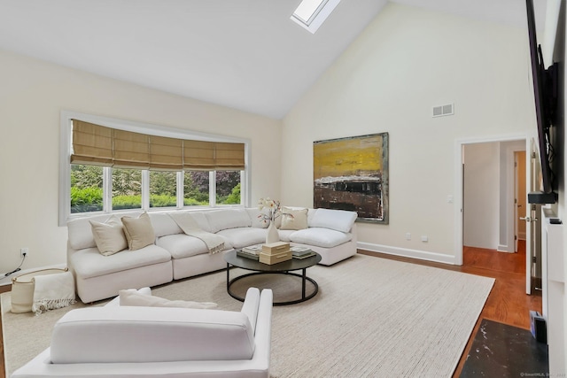 2787 Redding Rd, Fairfield, CT 06824 - living room featuring high vaulted ceiling, dark wood-type flooring, and a skylight