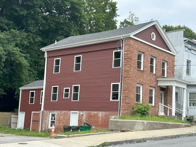 126 Broadway, Norwich, CT 06360 - view of side of property featuring brick siding