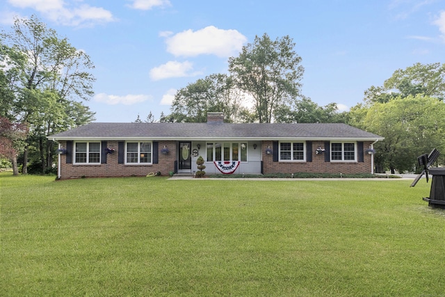 29 Birchwood Dr, Killingly, CT 06241 - ranch-style home featuring brick siding, a front lawn, and a chimney