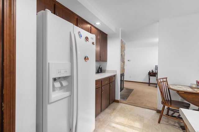 29 Birchwood Dr, Killingly, CT 06241 - kitchen featuring white fridge with ice dispenser, light colored carpet, light countertops, recessed lighting, and dark brown cabinetry