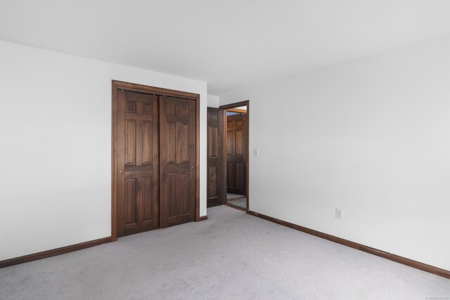 29 Birchwood Dr, Killingly, CT 06241 - unfurnished bedroom with light colored carpet and a closet