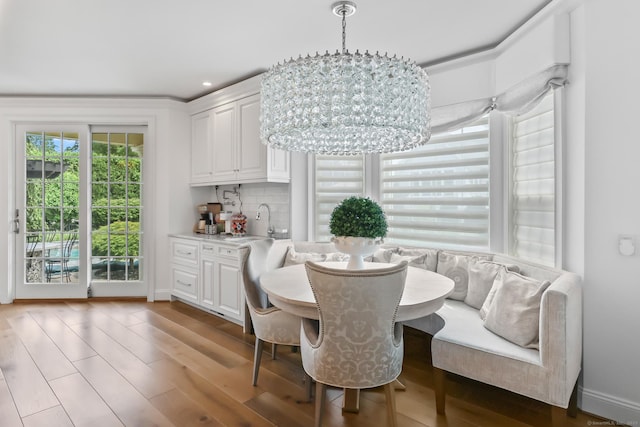 10 Amato Dr, Wethersfield, CT 06109 - dining space with breakfast area, a chandelier, wood finished floors, and recessed lighting