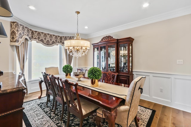 10 Amato Dr, Wethersfield, CT 06109 - dining space featuring a chandelier, wainscoting, crown molding, wood finished floors, and recessed lighting