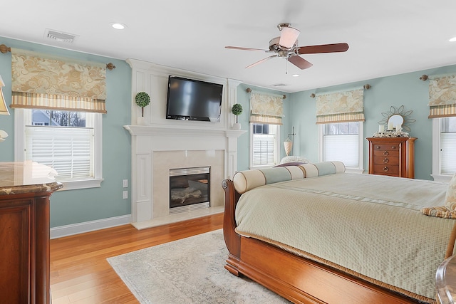10 Amato Dr, Wethersfield, CT 06109 - bedroom with wood finished floors, a fireplace, a ceiling fan, and recessed lighting