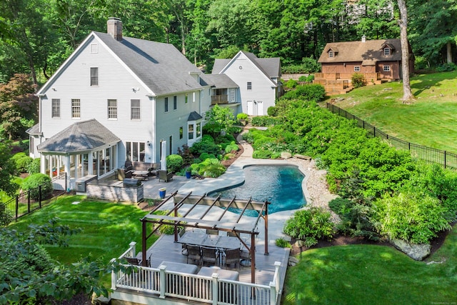 226 Nod Hill Rd, Wilton, CT 06897 - back of property featuring a wooden deck, a chimney, a fenced backyard, and outdoor dining area