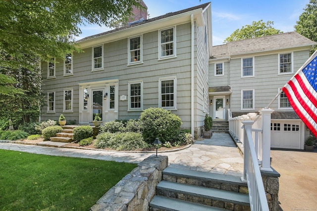 216 Hillspoint Rd, Westport, CT 06880 - colonial home featuring a chimney, a garage, and driveway
