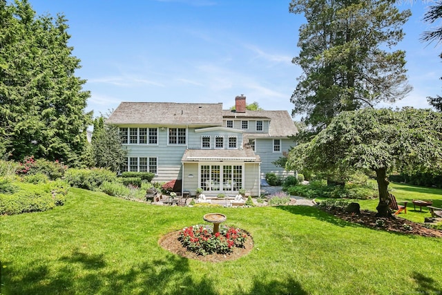 216 Hillspoint Rd, Westport, CT 06880 - back of property with a yard and a chimney