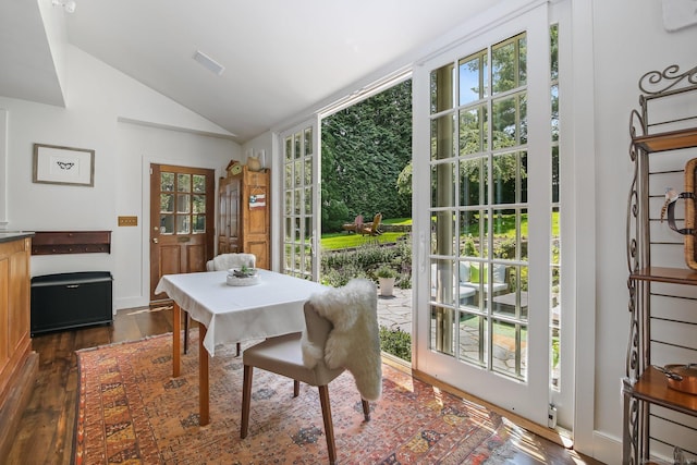 216 Hillspoint Rd, Westport, CT 06880 - dining area featuring vaulted ceiling, dark wood-type flooring, and plenty of natural light