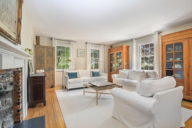 216 Hillspoint Rd, Westport, CT 06880 - living room with light wood-style floors and a fireplace