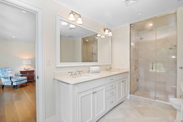 216 Hillspoint Rd, Westport, CT 06880 - bathroom featuring double vanity, a shower stall, and crown molding
