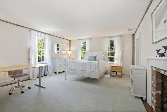 216 Hillspoint Rd, Westport, CT 06880 - bedroom featuring light carpet and a brick fireplace