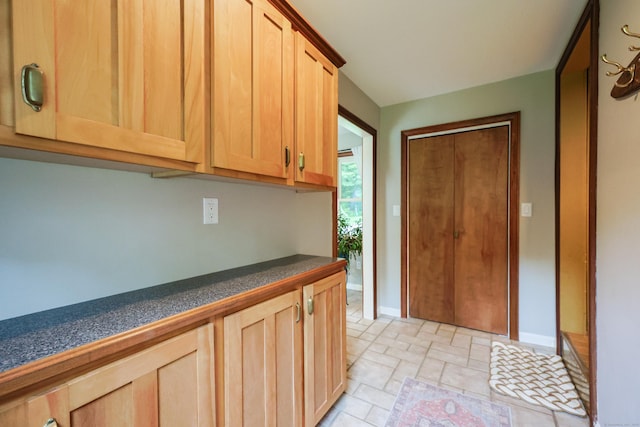 15 Harris Rd, Salem, CT 06420 - kitchen with dark countertops, light brown cabinetry, and light stone finish floors
