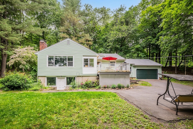 98 Torrington Ave, Canton, CT 06019 - view of front of home with a chimney, a wooden deck, view of scattered trees, a front lawn, and an outdoor structure