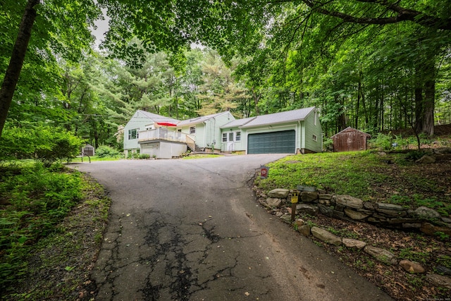 98 Torrington Ave, Canton, CT 06019 - view of front of property with driveway, a garage, and a deck