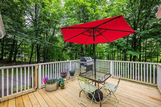 98 Torrington Ave, Canton, CT 06019 - deck featuring outdoor dining space, view of scattered trees, and area for grilling