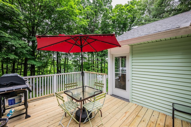 98 Torrington Ave, Canton, CT 06019 - wooden terrace with outdoor dining space and view of scattered trees