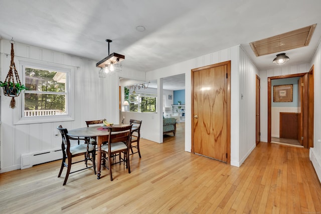 98 Torrington Ave, Canton, CT 06019 - dining room featuring light wood finished floors, baseboard heating, a decorative wall, and a chandelier