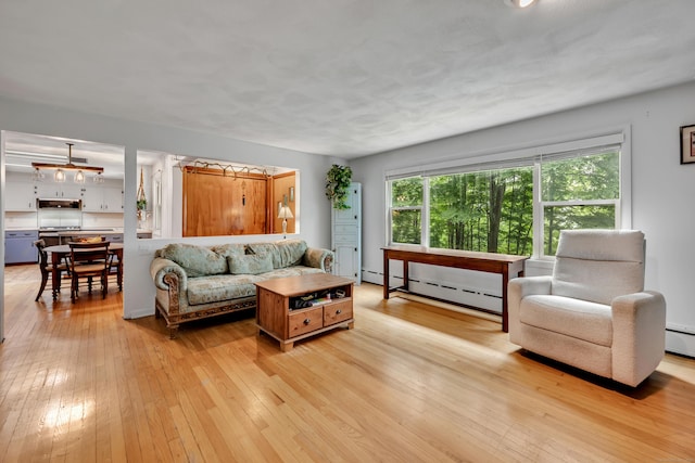 98 Torrington Ave, Canton, CT 06019 - living area with a baseboard radiator and light wood-style floors