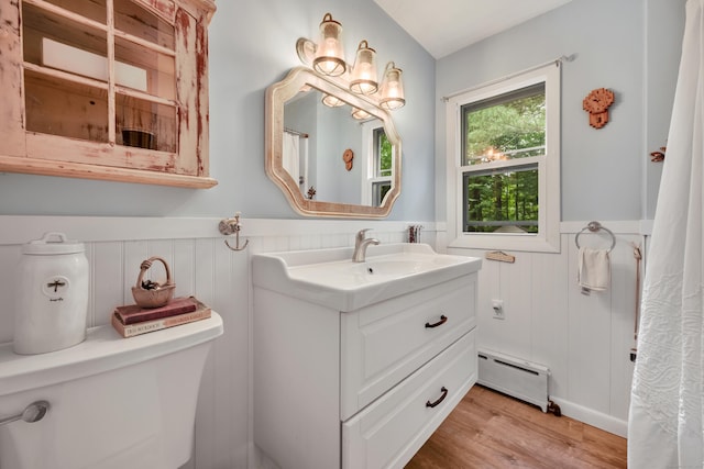 98 Torrington Ave, Canton, CT 06019 - full bath with a baseboard radiator, wainscoting, vanity, and wood finished floors