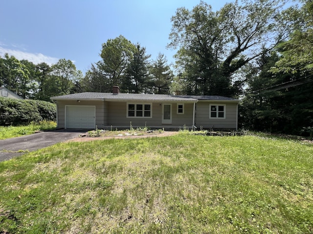 52 Sylvan St, Avon, CT 06001 - single story home with an attached garage, driveway, a chimney, and a front yard