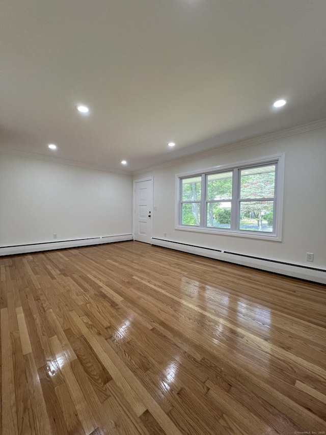 52 Sylvan St, Avon, CT 06001 - unfurnished room featuring a baseboard heating unit, crown molding, wood finished floors, and recessed lighting