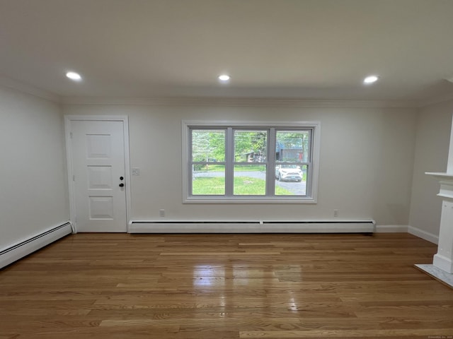 52 Sylvan St, Avon, CT 06001 - unfurnished room with a baseboard radiator, crown molding, recessed lighting, wood finished floors, and a fireplace with flush hearth