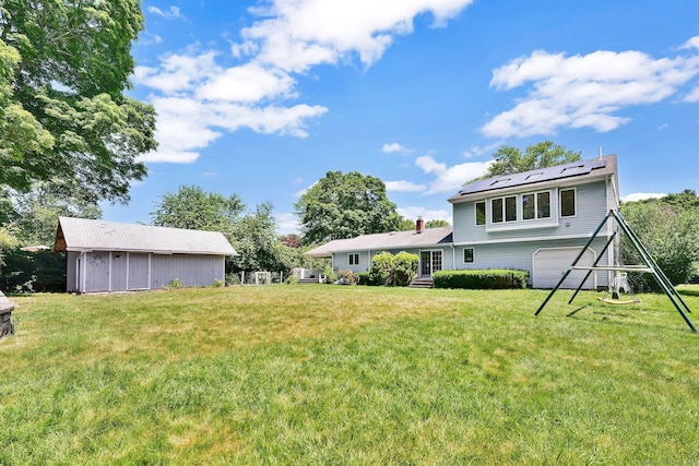 97 Benedict Dr, South Windsor, CT 06074 - view of green lawn with an attached garage