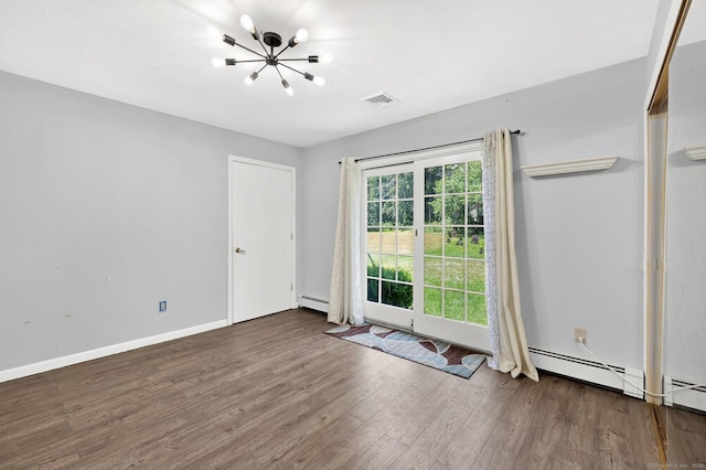97 Benedict Dr, South Windsor, CT 06074 - spare room with a chandelier, wood finished floors, and a baseboard heating unit