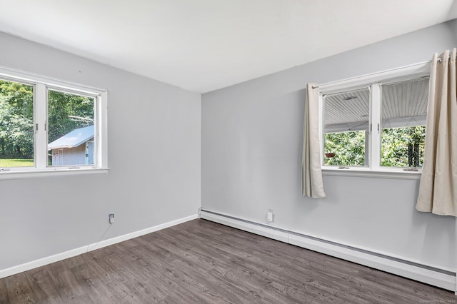97 Benedict Dr, South Windsor, CT 06074 - spare room with a baseboard heating unit and wood finished floors