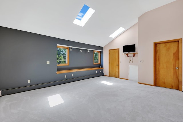 97 Benedict Dr, South Windsor, CT 06074 - carpeted empty room featuring a skylight, a baseboard heating unit, and high vaulted ceiling