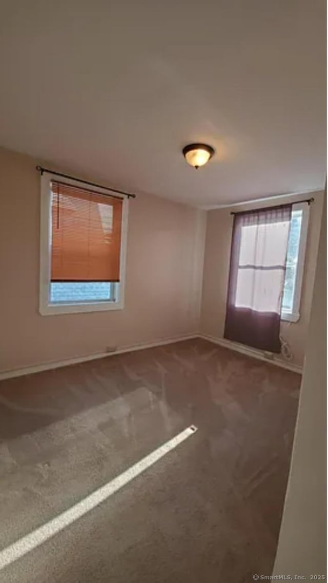 366 Remington St, Bridgeport, CT 06610 - carpeted empty room with baseboards