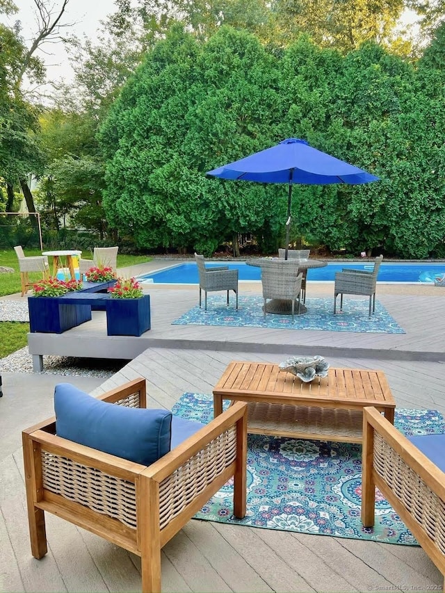 13 Charter Oak Dr, East Lyme, CT 06333 - view of patio / terrace with a deck, an outdoor pool, and outdoor dining area