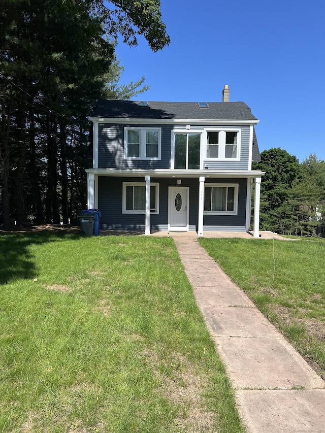 372 Oakland St, Manchester, CT 06042 - view of front of property featuring a chimney, a front lawn, and covered porch