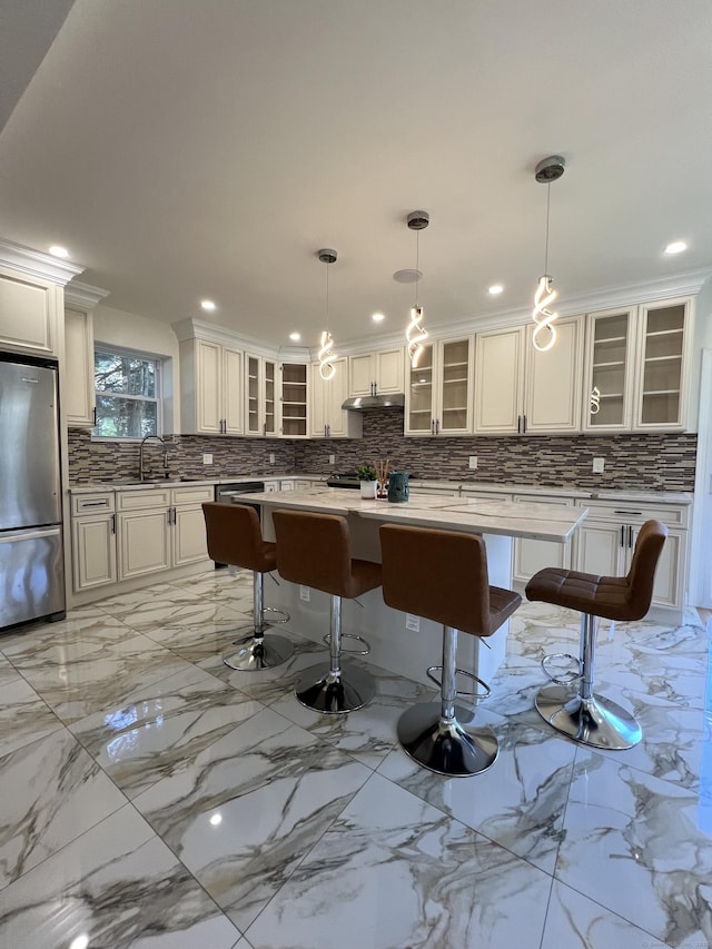 372 Oakland St, Manchester, CT 06042 - kitchen with freestanding refrigerator, tasteful backsplash, glass insert cabinets, and recessed lighting