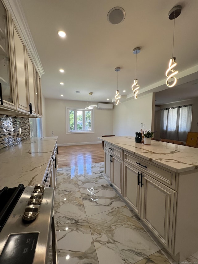 372 Oakland St, Manchester, CT 06042 - kitchen with a wall unit AC, recessed lighting, light marble finish flooring, decorative backsplash, and glass insert cabinets