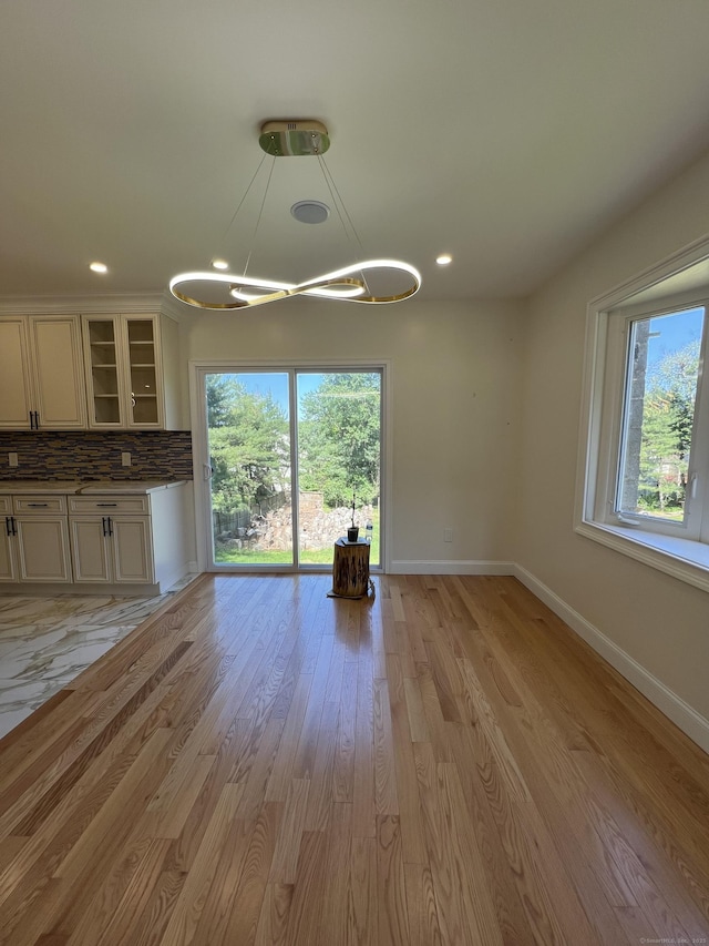 372 Oakland St, Manchester, CT 06042 - unfurnished living room with a chandelier, healthy amount of natural light, light wood-style floors, and recessed lighting