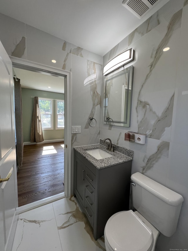 372 Oakland St, Manchester, CT 06042 - bathroom featuring marble finish floors, vanity, and recessed lighting