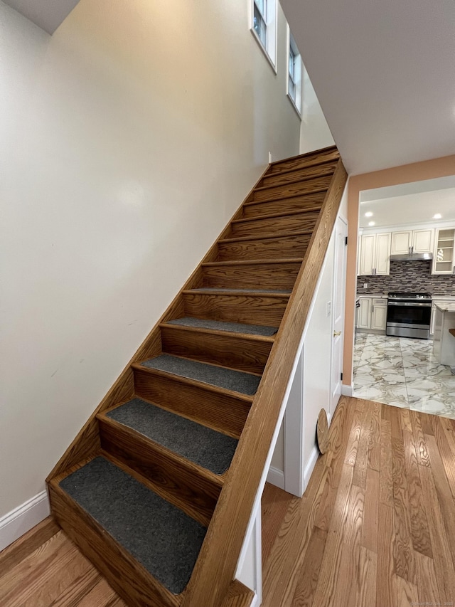 372 Oakland St, Manchester, CT 06042 - stairs with wood finished floors and baseboards