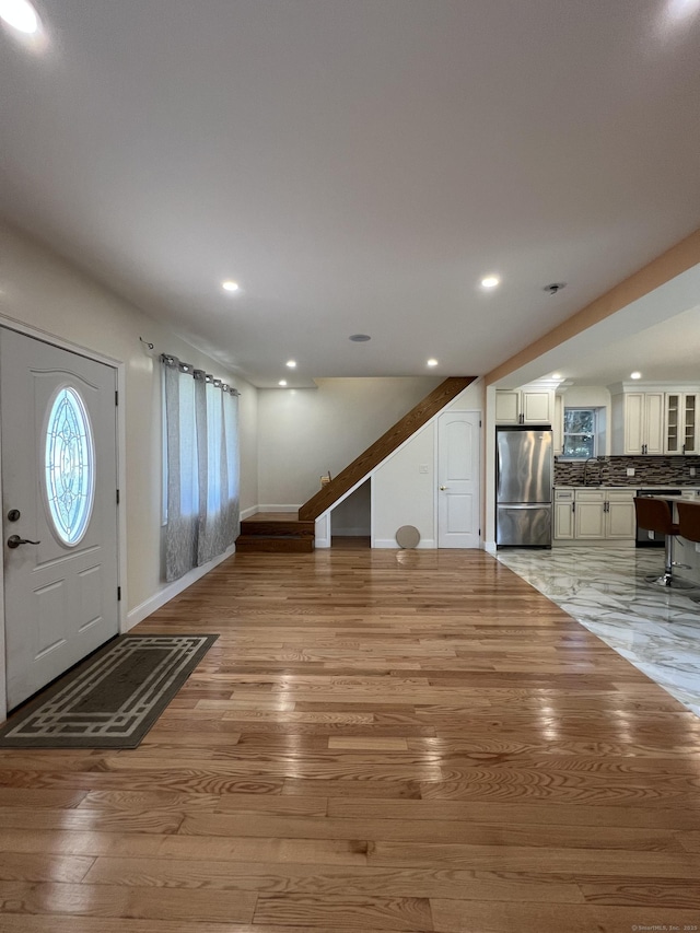 372 Oakland St, Manchester, CT 06042 - entryway with stairs, light wood finished floors, and recessed lighting