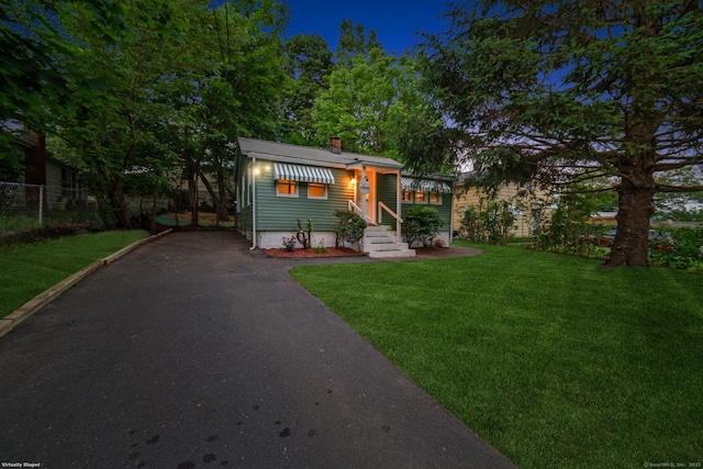 486 Barlow St, Bristol, CT 06010 - view of front of home with driveway, a chimney, and entry steps