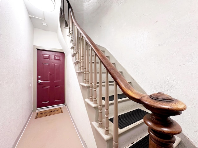 16 Dickerman St, New Haven, CT 06511 - stairs with a textured wall and baseboards