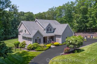 299 Warpas Rd, Madison, CT 06443 - view of front of property with a front lawn
