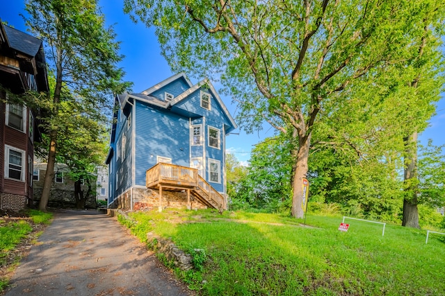 156 Waterville St, Waterbury, CT 06710 - victorian house featuring driveway, stairs, and a wooden deck