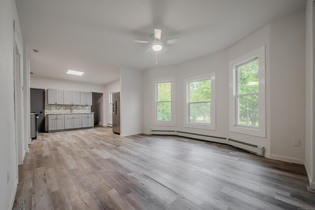 156 Waterville St, Waterbury, CT 06710 - unfurnished living room featuring a baseboard radiator, a ceiling fan, and light wood-style flooring